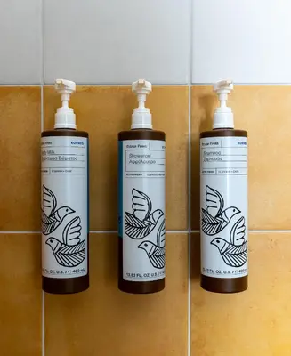 a group of three bottles on a tiled wall at Flâneur in Chania Town