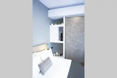 a room with a shower and a bed and a door at C-Home Studio in the heart of Chania in Chania Town