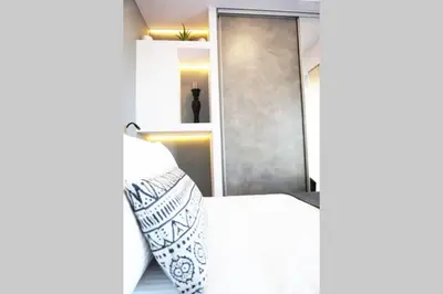 a bedroom with a bed and a mirror at C-Home Studio in the heart of Chania in Chania Town