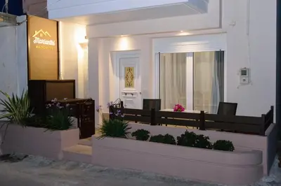 a building with two flower pots on the side of it at Marianthi's Maisonette in Chania Town