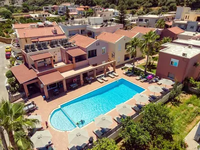 an aerial view of a villa with a swimming pool at Theos Holidays Apartments in Kato Daratso
