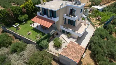 an overhead view of a house with a red roof at Hilltop Villa Kontomari in Kondomari