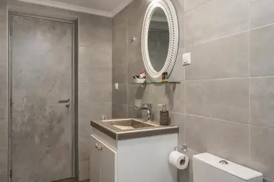 a bathroom with a sink and a mirror at Villa Alitocatos in Drapaniás