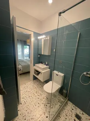 a bathroom with a toilet and a sink at Leonidas House in Chania Town