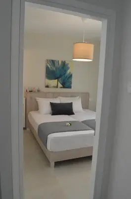 a bedroom with a bed and a light fixture at Leonidas House in Chania Town