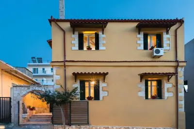 aige house with windows and a staircase in front at Dominic Chania 2 Room Apartment in Chania Town