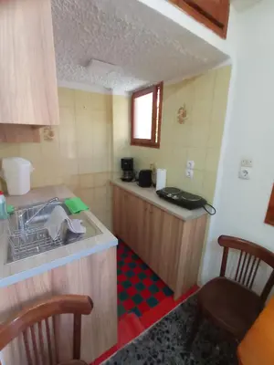 a small kitchen with a counter and a sink at Tasos Seagull apartments in Chania Town