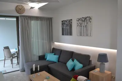a living room with a couch and a table at Filia Luxury Apartment in Chania Town