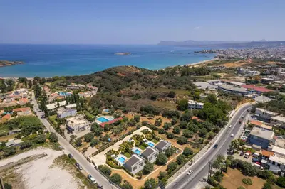 an aerial view of a city and the ocean at Ethereal Villas Chania in Daratso