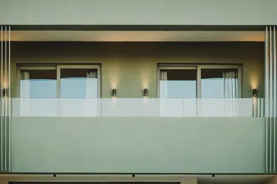 a balcony of a building with three windows at Lux sea view villa by Chania LIving Stories in Chania Town