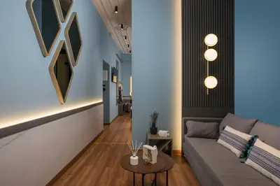 a living room with a couch and a table at Veneri Boutique Suites in Chania Town