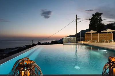 a swimming pool with a view of the ocean at Villa Thetis Sfakia in Sfakiá