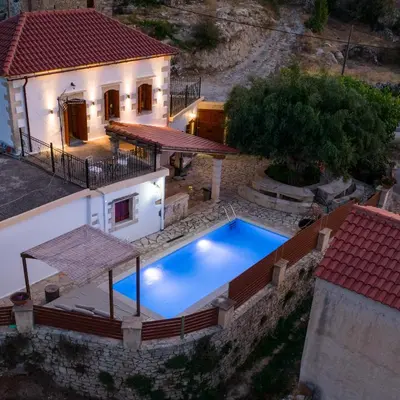 an aerial view of a house with a swimming pool at Villa Tzitzifes in Tzitzifés