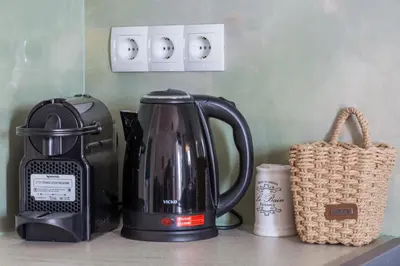 a coffeemaker and a tea kettle on a counter at kissamos seaside bliss in Kissamos
