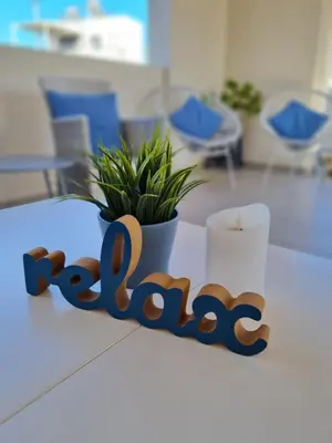 a table with the wordabuse spelled out iniger at Marika's Penthouse Chania in Chania Town