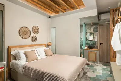 a bedroom with a bed in a room at Villas Plumeria in Palaiochóra