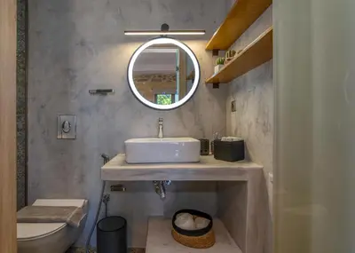 a bathroom with a sink and a mirror at Villa Maritini in Chania Town