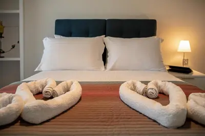 a bedroom with a bed with two towels on it at Villa Enny, 3 BD with Private Heated Pool in Ayiá
