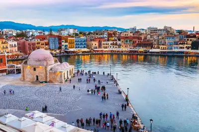 a group of people walking on a bridge over a body of water at Kappa Residence in Chania Town