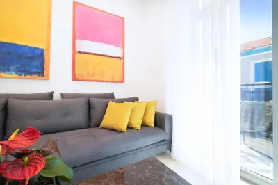 a living room with a couch and a window at Kappa Residence in Chania Town