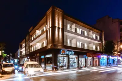 a building on a city street at night at ANTEL Suites & Apartments in Chania Town