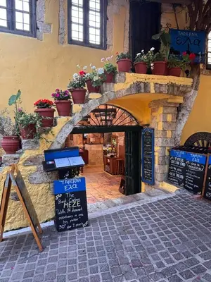 a stone archway with potted plants on a building at Belle Verte City Chania in Chania Town