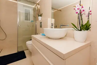 a bathroom with a sink and a toilet and a shower at Belle Verte City Chania in Chania Town