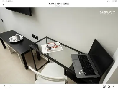 a black table with a laptop on top of it at Chania Center Apartment in Chania Town