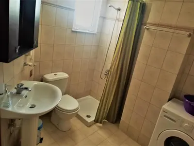 a bathroom with a sink and a toilet and a shower at Alkioni City Apartments in Chania Town