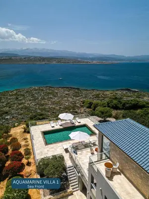 an aerial view of a house with a swimming pool at Seacrete villas in Chania Town