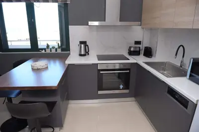 a kitchen with a sink and a stove top oven at Phaedra's Studios in Kolymbari in Chania Town