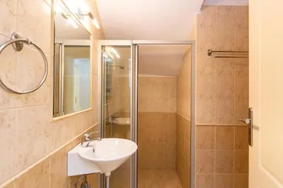 a bathroom with a sink and a shower at Lake and Sea Villa in Tersanas