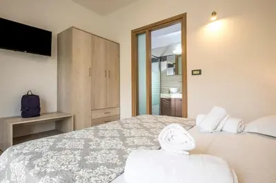a bedroom with a large bed and a television at Park View and near the Sea Villa with Private Pool 1 in Chania Town
