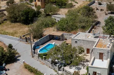 an aerial view of a house with a swimming pool at Archodiko Villa Imbros in Ímbros