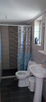 a bathroom with a toilet and a sink at Chania City Apartments in Chania Town