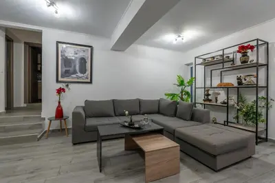 a living room with a couch and a table at Vista Magica in Chania Town