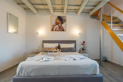 a bedroom with a large bed in a room at Vista Magica in Chania Town