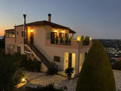 a villa with a view of a building at Zafeiria's Suite in Vamos