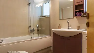 a bathroom with a sink and a shower at Happiness Luxury Home in Palaiochóra