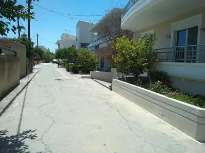 an empty street in front of a building at Happiness Luxury Home in Palaiochóra