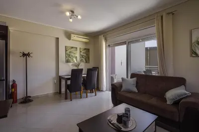 a living room with a couch and a table at Lazaretta apartment in Chania Town