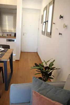 a living room with a couch and a table at New Cozy Chic Apt-Ryfete Luxury Living in Kalathas