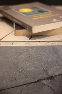 two books sitting on top of a wooden table at New Cozy Chic Apt-Ryfete Luxury Living in Kalathas