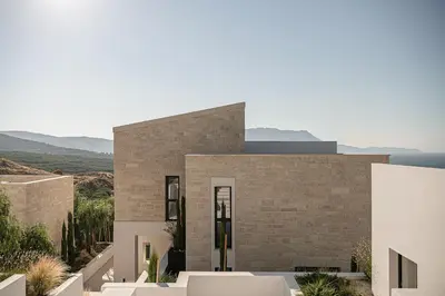 a brick house with a view of the ocean at Villas Phos and Kallos in Kissamos