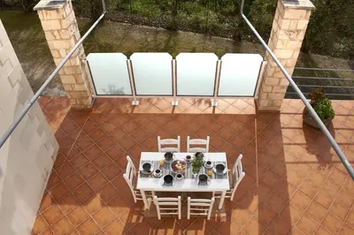 an overhead view of a table and chairs on a patio at Villa Politini by PosarelliVillas in Vryses