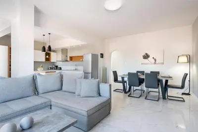 a living room with a couch and a table at West City Apartment in Chania Town