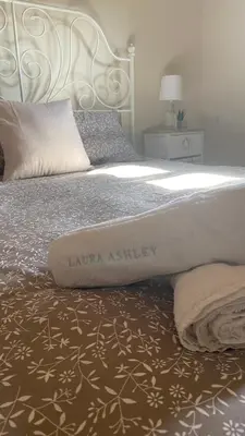 a bedroom with a large bed with a white headboard at Ampelos Cretan Villa - Private Pool & Heated Ozone Jacuzzi in Gerolakkos