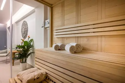 a sauna with towels on a wooden wall at Imperium Luxury Villas-Sauna, Jacuzzi, Heated Pool & Gym-Chania in Kato Galatas