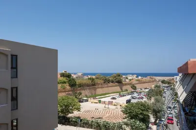 a view of a parking lot from a building at Urban Residences Chania in Chania Town