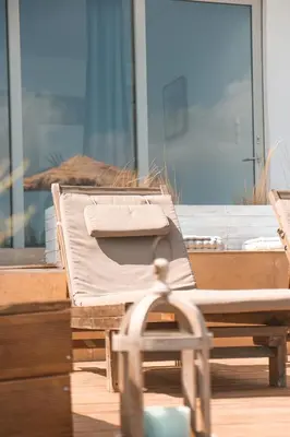 a bed sitting on top of a wooden table at Esperanto seafront studio in Agia Marina Nea Kydonias